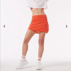 OV orange tennis skirt